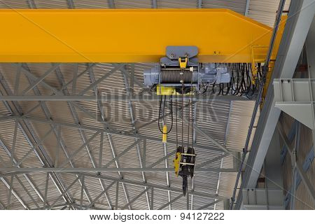 Indoor Overhead Crane On A Yellow Steel Beam