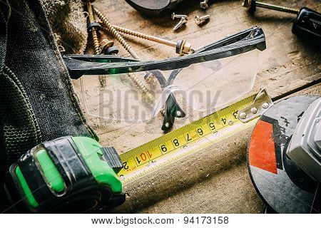 Different tools on a wooden background.