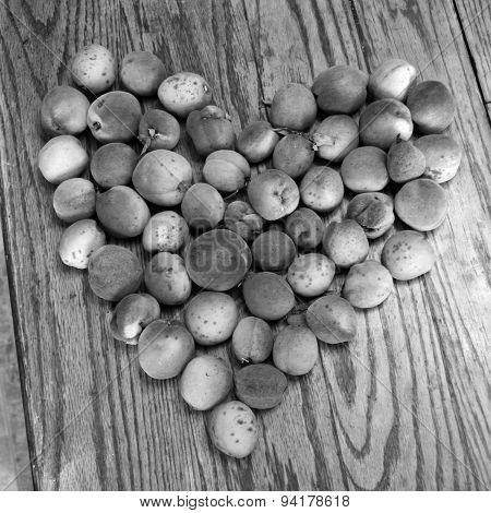 Black And White Square Shot Of Peaches In A Heart Shape
