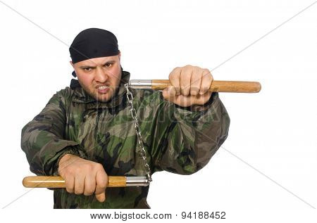 Young man in soldier uniform holding nunchaks isolated on white
