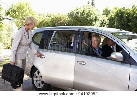 Group Of Business Colleagues Car Pooling Journey Into Work