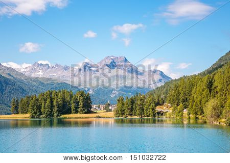 Great view of the azure pond Champfer in alpine valley. Popular tourist attraction. Picturesque and gorgeous scene. Location Swiss alps, Silvaplana village, district of Maloja, Europe. Beauty world.