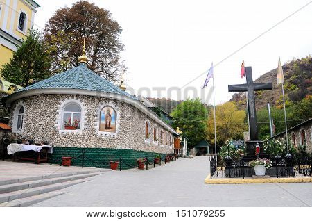 Ancient monastery. Village Saharna. Stone crucifix in orthodox monastery Saharna Republic of Moldova.