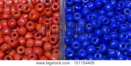 Lots of colorful fusible plastic beads used for arts and craft.