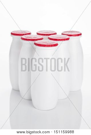 Yogurt containers healthy vitamin drink on white background