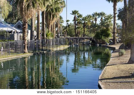 Bridge over water leading to a popular family holiday destination in Phoenix downtown Enchanted Island.