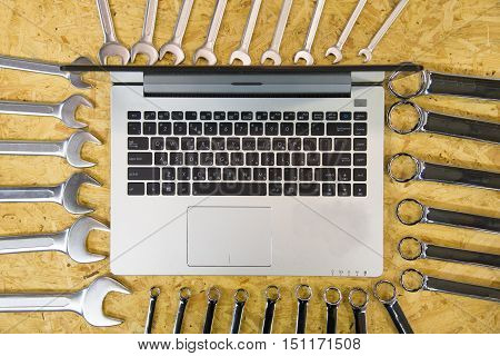 Do it yourself home remodeling and renovation concept work table top view with tools project laptop house model and keys tools work keys computer.