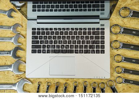 Do it yourself home remodeling and renovation concept work table top view with tools project laptop house model and keys tools work keys computer.