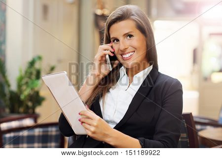 Picture of young businesswoman working in cafe