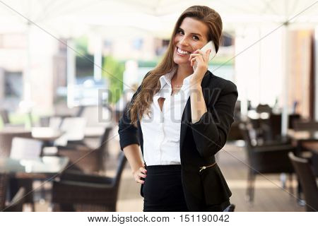 Picture of young businesswoman working cafe