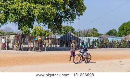 Caprivi, Namibia - August 20, 2016: Poor Teenagers Walking On The Roadside In The Rural Caprivi Stri