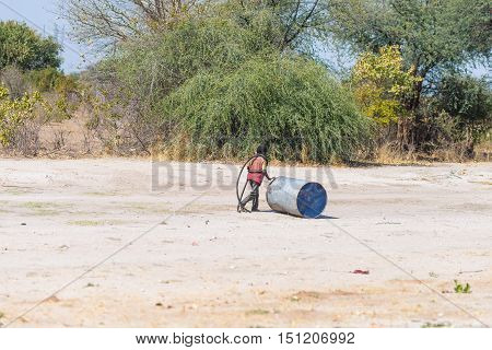 Caprivi, Namibia - August 20, 2016: Poor Teenager Playing On The Roadside In The Rural Caprivi Strip