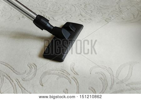 cleaning carpet with a vacuum cleaner universal nozzle