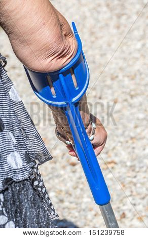 Senior woman with crutches - isolated on white