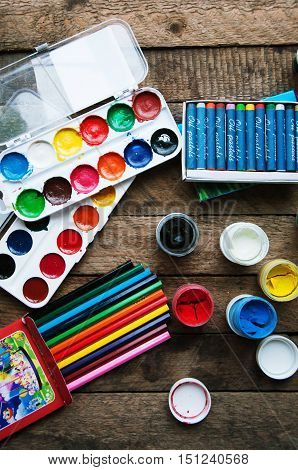 Art Of Painting. Paint Buckets On Wood Background. Different Pai