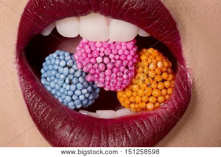 Close eup of female eating sweets seductively