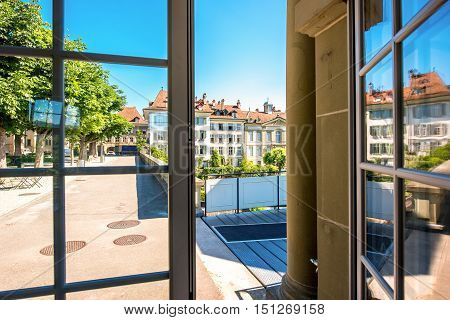 View from the window on the park and buildings near Munster church in the old town of Bern in Switzerland