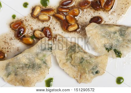 closeup of some italian schlutzkrapfen filled pasta