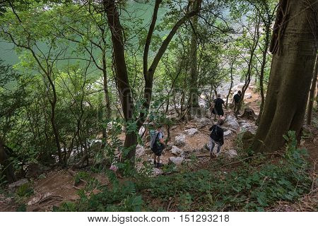 People coming down the trail to the river Ardèche France.