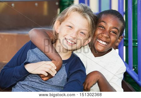 Happy Young Friends Sitting Together