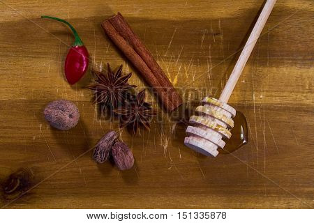 Spices honey and chili on cutting board
