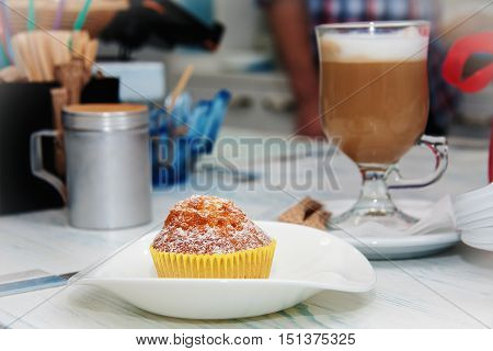 cappuccino and homemade cake in blue table