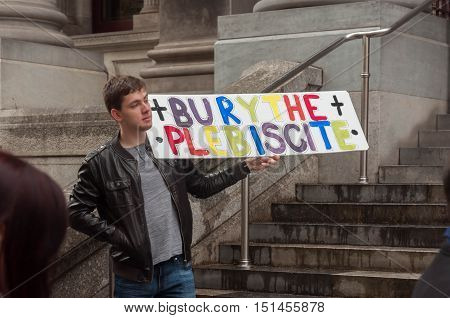 ADELAIDE, AU - SEPTEMBER 4, 2016: South Australians supporters of marriage equality gather outside Parliament House to express opposition to the Australian Federal Government's plan for the 2017 plebiscite.