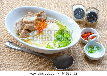 boiled rice with pork rib hot soup on bowl