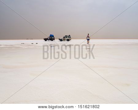 AFAR REGION ETHIOPIA - JUNE 26 2016: Tourists visiting salt desert and lake in the Afar Region Danakil Depression Ethiopia.