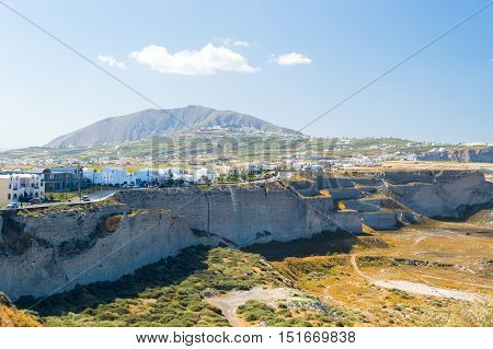 Santorini island in Greece landscape steep cliffs dirt roads and vegetation burned