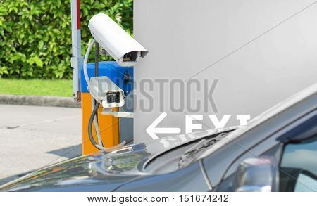 Security equipment concept - CCTV camera surveillance on car parking with space for text