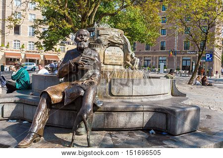 Brussels, Belgium - April 5, 2008: Tourists Seating Near Charles Buls Fountain