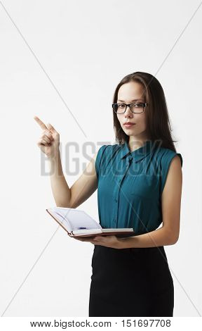 business woman in glasses, working with documents and pen, it shows on the subject, on a white background