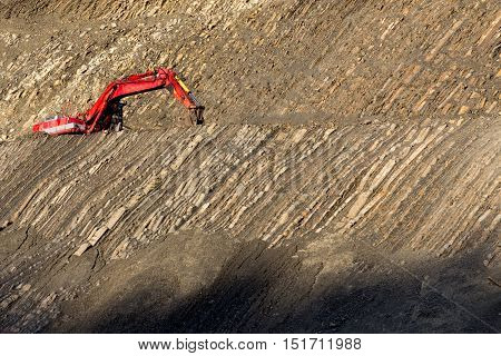 Red Digger In Stone-pit