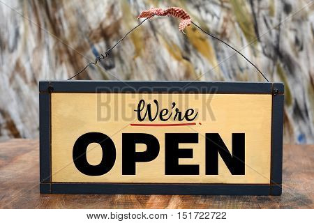 We're Open Shop Sign on Wood Frame.