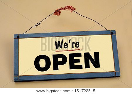 We're Open Shop Sign on Wood Frame.