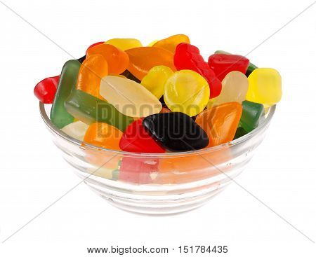 Colorful winegums in a glass bowl isolated on white background.