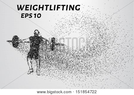 Weightlifting of particles. Athlete raises the bar in the snatch.