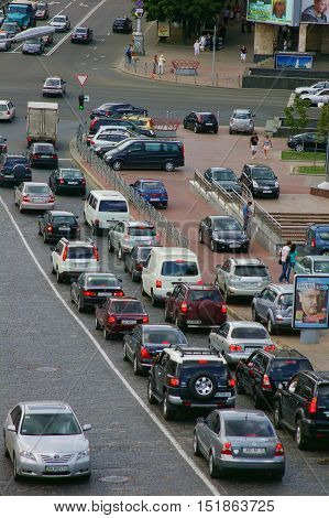 KYIV UKRAINE - July 22 2009: Traffic jam in city center on July 22 2009 in Kiev Ukraine.The urban road traffic jams during the rush hour.Group of car moving in line on street.Traffic jams remains constant problem despite rapid development of public transp