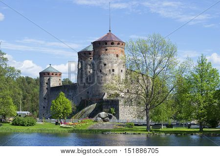 View of the old fortress Olafsborg (Olavinlinna), june sunny day. Savonlinna, Finland