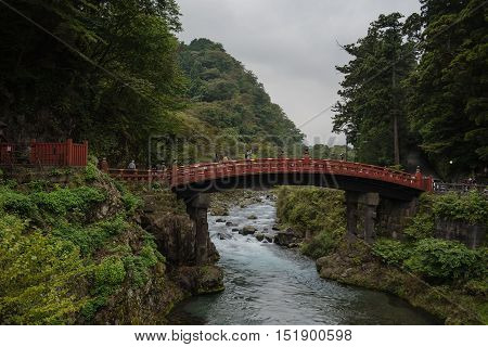 NIKKO, JAPAN - OCTOBER 13 ,2016 : Shinkyo (Sacred Bridge) stands at the entrance to Futarasan Shrine. Red sacred bridge Shinkyo in UNESCO of Nikko.