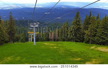 Sski Lift On The Rila Mountains In Bulgaria In The Summer Against The Backdrop Of The Forest.