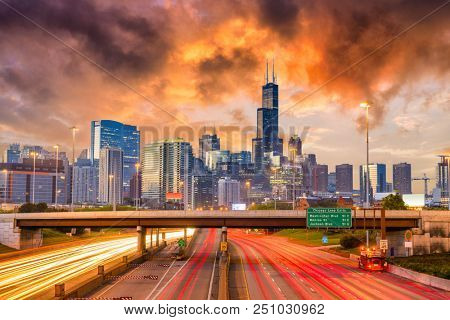 Chicago, Illinois, USA downtown skyline over highways at twilight.