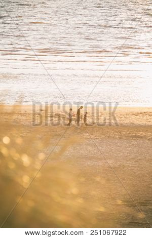 Family Enjoys The Beach During Golden Hour And Sunset, Formby Liverpool