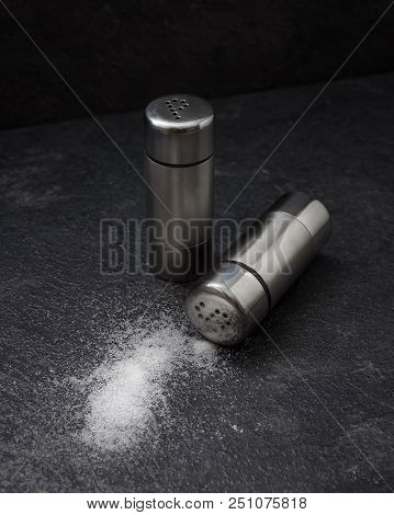 Salt And Pepper In Metal Shakers. Ingredients For Cooking.