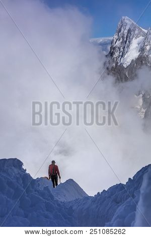 Climber On The Mont Blanc Massif. View From Aiguille Du Midi Mount -3,842 M, France