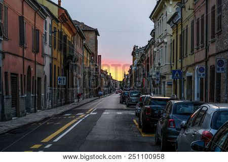 Ferrara, Italy - July, 23, 2018: cars parked in Ferrara, Italy, in evening