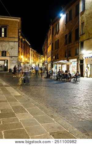 Ferrara, Italy - July, 23, 2018: street in the historical center of Ferrara at a night