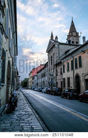 Ferrara, Italy - July, 23, 2018: cars parked in Ferrara, Italy, in evening