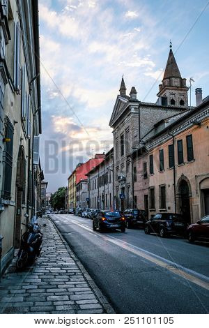 Ferrara, Italy - July, 23, 2018: cars parked in Ferrara, Italy, in evening
